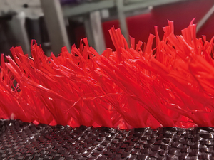 Red synthetic grass for landscape decoration.jpg